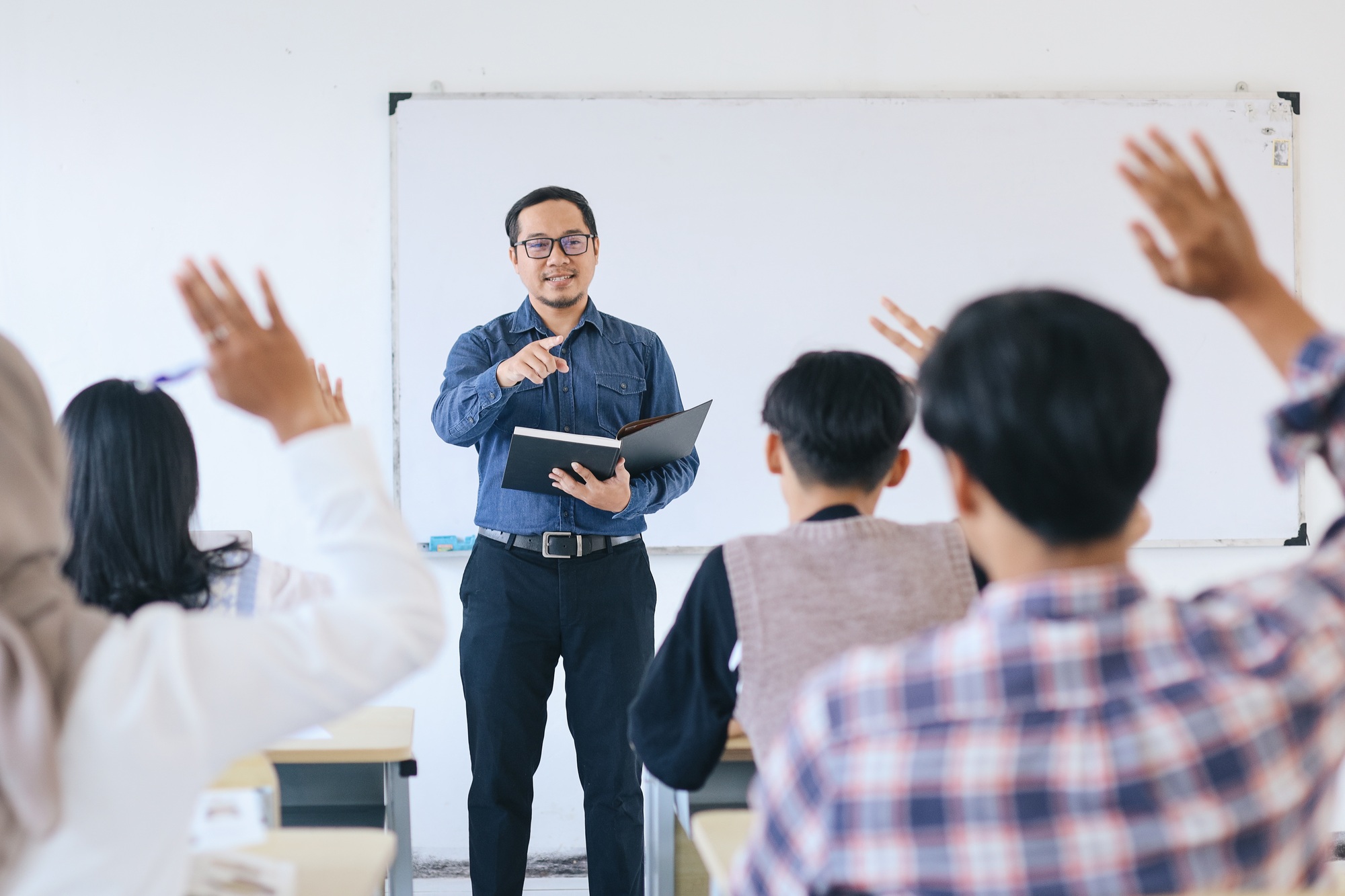 Teacher Pointing a Student